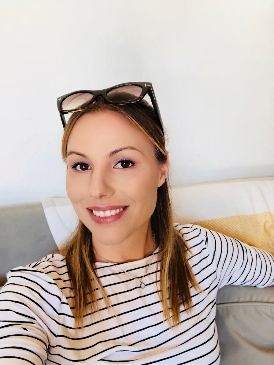 Kenna Knight-Schoeler, founder of White Lily Reiki, smiling warmly
